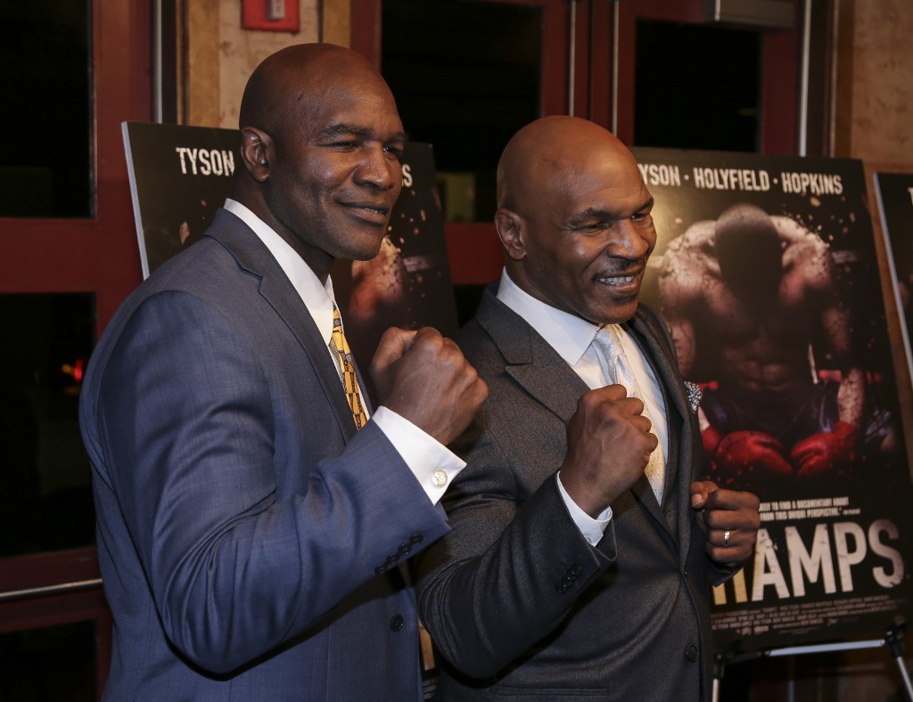 NEW YORK, NY - MARCH 12: Evander Holyfield (L) and Mike Tyson pose during the screening of 'Champs' at Village East Cinema on March 12, 2015 in New York City, United States. Bilgin Sasmaz / Anadolu Agency