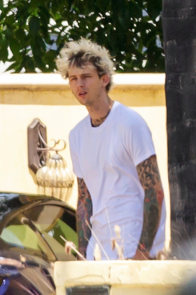 Los Angeles, CA  - *EXCLUSIVE*  - Rapper Machine Gun Kelly steps outside his LA home to get some fresh air and sun with a female friend.  After his recent outing with Meghan Fox, MGK appears to be trying to let the news settle down for now.

*UK Clients - Pictures Containing Children
Please Pixelate Face Prior To Publication*, Image: 520193079, License: Rights-managed, Restrictions: , Model Release: no, Credit line: 4CRNS, WCP / BACKGRID / Backgrid USA / Profimedia