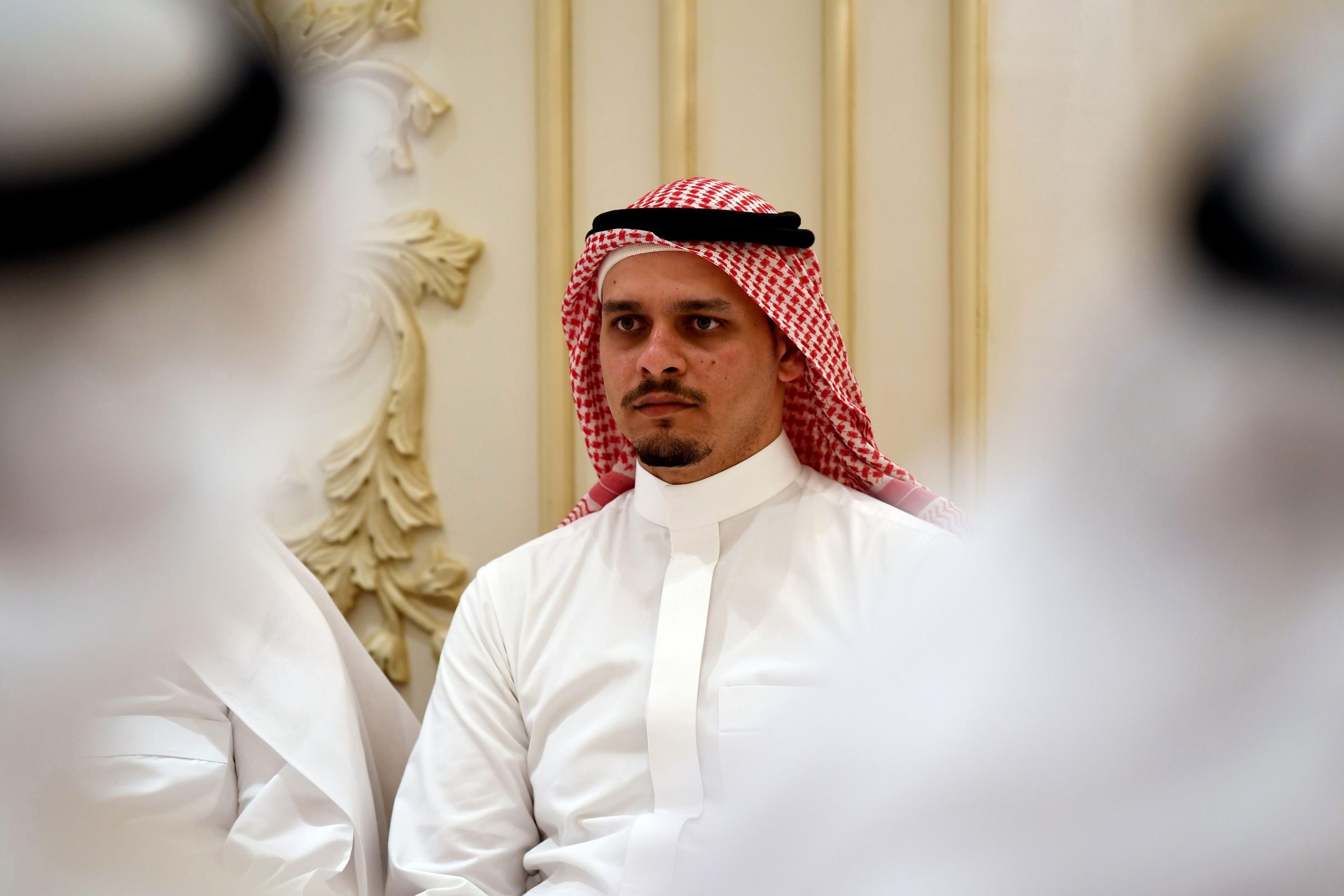 (FILES) In this file photo Salah Khashoggi, the son of murdered Saudi journalist Jamal Khashoggi, and his relatives receive mourners at an events hall in the Saudi coastal city of Jeddah on November 16, 2018. - The sons of murdered Saudi journalist Jamal Khashoggi said Friday that they 