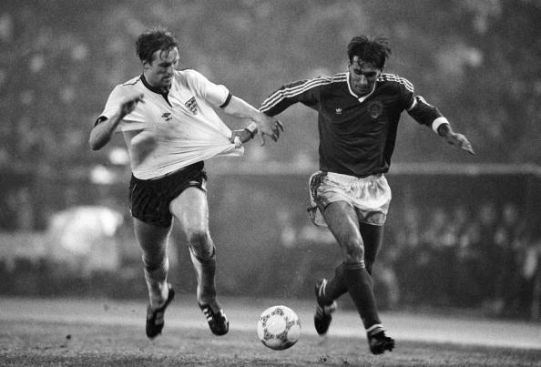 Yugoslavia captain Zlatko Vujovic (right) takes a firm grip on England defender Gary Stevens during their European Championship Qualifying match held in Belgrade on 11th November 1987.  England beat Yugoslavia 4-1.  (Photo by Bob Thomas/Getty Images.)