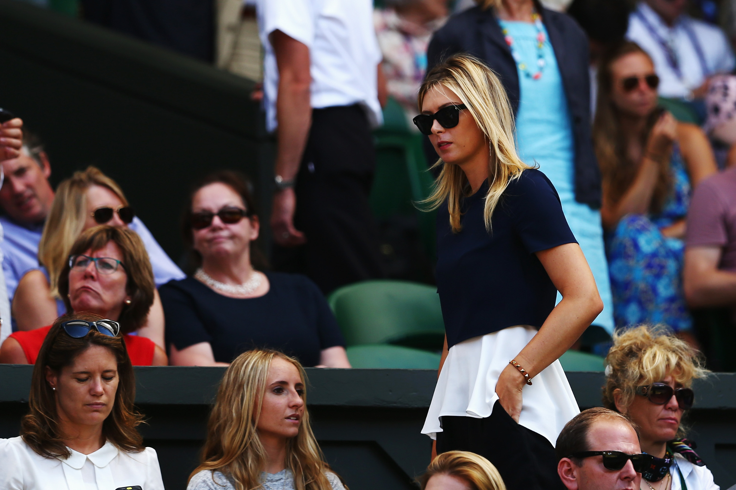 LONDON, ENGLAND - JULY 04:  Maria Sharapova of Russia the girlfriend of Grigor Dimitrov of Bulgaria watches his Gentlemen's Singles semi-final match against Novak Djokovic of Serbia on day eleven of the Wimbledon Lawn Tennis Championships at the All England Lawn Tennis and Croquet Club on July 4, 2014 in London, England.  (Photo by Clive Brunskill/Getty Images)