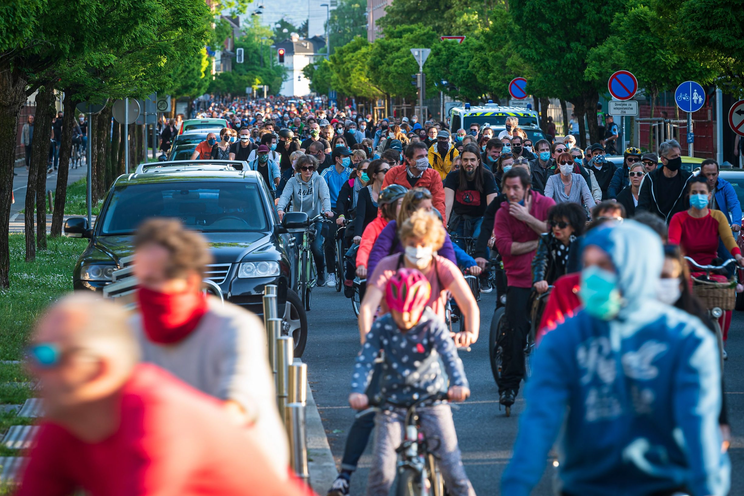 Slovenian citizens, some wearing protective masks, ride their bikes as they block the centre of capital Ljubljana to protest against the centre-right government, accusing it of corruption and of using the novel coronavirus crisis to restrict freedom on May 8, 2020 amid the COVID-19 outbreak, caused by the novel coronavirus. (Photo by Jure Makovec / AFP)