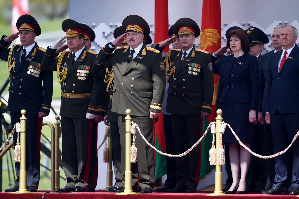 Belarus' President Alexander Lukashenko salutes as he watches a military parade to mark the 75th anniversary of the Soviet Union's victory over Nazi Germany in World War Two, Minsk, May 9, 2020. (Photo by Sergei GAPON / POOL / AFP)