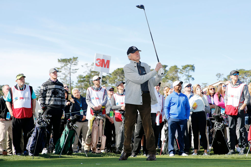 PEBBLE BEACH, CALIFORNIA - FEBRUARY 05: Actor Clint Eastwood plays his shot from the first tee during the 3M Celebrity Challenge prior to the AT&T Pebble Beach Pro-Am at Pebble Beach Golf Links on February 05, 2020 in Pebble Beach, California. (Photo by Michael Reaves/Getty Images)