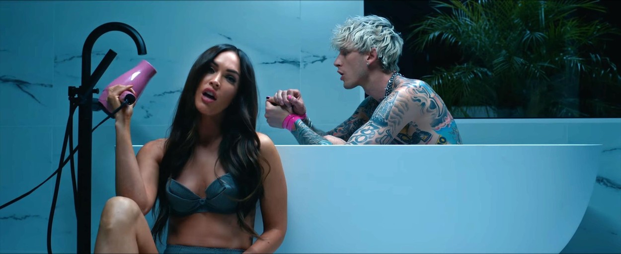 Los Angeles, CA  - Megan Fox and Machine Gun Kelly steam up the screen in his new music video Bloody Valentine amid rumours of a real life romance. The sexy video comes after Fox's husband, actor Brian Austin Green confirmed that they had split after ten years of marriage and three children together. The video kicks off with the pair in bed - before things turn a little kinky. A completely nude Machine Gun Kelly - real name Colson Baker - asks Megan to rip a long strip of tape off of his back. The two are then seen in a sauna together and MGK is completely naked while bound by tape as Megan relaxes in a towel. In another scene she feeds him a pastry before putting neon pink tape over his mouth while in another part of the video, MGK sits in the bath while Fox, clad in lingerie, drops a hairdryer into the water, electrocuting him. The duo sparked romance rumours after they were seen spending time together last week following Megan's split from Green.

The rapper asks the brunette bombshell: 'Hey Megan could you rip the one on this one?'

*BACKGRID DOES NOT CLAIM ANY COPYRIGHT OR LICENSE IN THE ATTACHED MATERIAL. ANY DOWNLOADING FEES CHARGED BY BACKGRID ARE FOR BACKGRID'S SERVICES ONLY, AND DO NOT, NOR ARE THEY INTENDED TO, CONVEY TO THE USER ANY COPYRIGHT OR LICENSE IN THE MATERIAL. BY PUBLISHING THIS MATERIAL , THE USER EXPRESSLY AGREES TO INDEMNIFY AND TO HOLD BACKGRID HARMLESS FROM ANY CLAIMS, DEMANDS, OR CAUSES OF ACTION ARISING OUT OF OR CONNECTED IN ANY WAY WITH USER'S PUBLICATION OF THE MATERIAL*

BACKGRID UK 22 MAY 2020,Image: 521420433, License: Rights-managed, Restrictions: RIGHTS: WORLDWIDE EXCEPT IN UNITED STATES, Model Release: no, Credit line: Interscope Records / BACKGRID / Backgrid UK / Profimedia