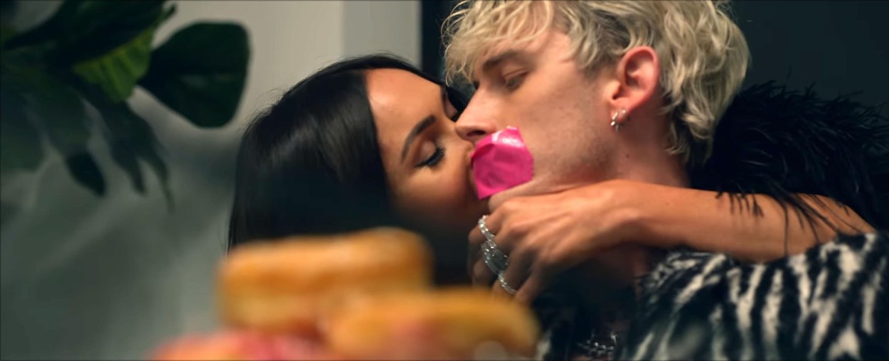 Los Angeles, CA  - Megan Fox and Machine Gun Kelly steam up the screen in his new music video Bloody Valentine amid rumours of a real life romance. The sexy video comes after Fox's husband, actor Brian Austin Green confirmed that they had split after ten years of marriage and three children together. The video kicks off with the pair in bed - before things turn a little kinky. A completely nude Machine Gun Kelly - real name Colson Baker - asks Megan to rip a long strip of tape off of his back. The two are then seen in a sauna together and MGK is completely naked while bound by tape as Megan relaxes in a towel. In another scene she feeds him a pastry before putting neon pink tape over his mouth while in another part of the video, MGK sits in the bath while Fox, clad in lingerie, drops a hairdryer into the water, electrocuting him. The duo sparked romance rumours after they were seen spending time together last week following Megan's split from Green.

The rapper asks the brunette bombshell: 'Hey Megan could you rip the one on this one?'

*BACKGRID DOES NOT CLAIM ANY COPYRIGHT OR LICENSE IN THE ATTACHED MATERIAL. ANY DOWNLOADING FEES CHARGED BY BACKGRID ARE FOR BACKGRID'S SERVICES ONLY, AND DO NOT, NOR ARE THEY INTENDED TO, CONVEY TO THE USER ANY COPYRIGHT OR LICENSE IN THE MATERIAL. BY PUBLISHING THIS MATERIAL , THE USER EXPRESSLY AGREES TO INDEMNIFY AND TO HOLD BACKGRID HARMLESS FROM ANY CLAIMS, DEMANDS, OR CAUSES OF ACTION ARISING OUT OF OR CONNECTED IN ANY WAY WITH USER'S PUBLICATION OF THE MATERIAL*

BACKGRID UK 22 MAY 2020,Image: 521420528, License: Rights-managed, Restrictions: RIGHTS: WORLDWIDE EXCEPT IN UNITED STATES, Model Release: no, Credit line: Interscope Records / BACKGRID / Backgrid UK / Profimedia