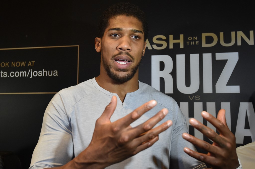 British heavyweight boxing challenger Anthony Joshua arrives for a press conference in the Saudi capital Riyadh on December 2, 2019, ahead of the upcoming 