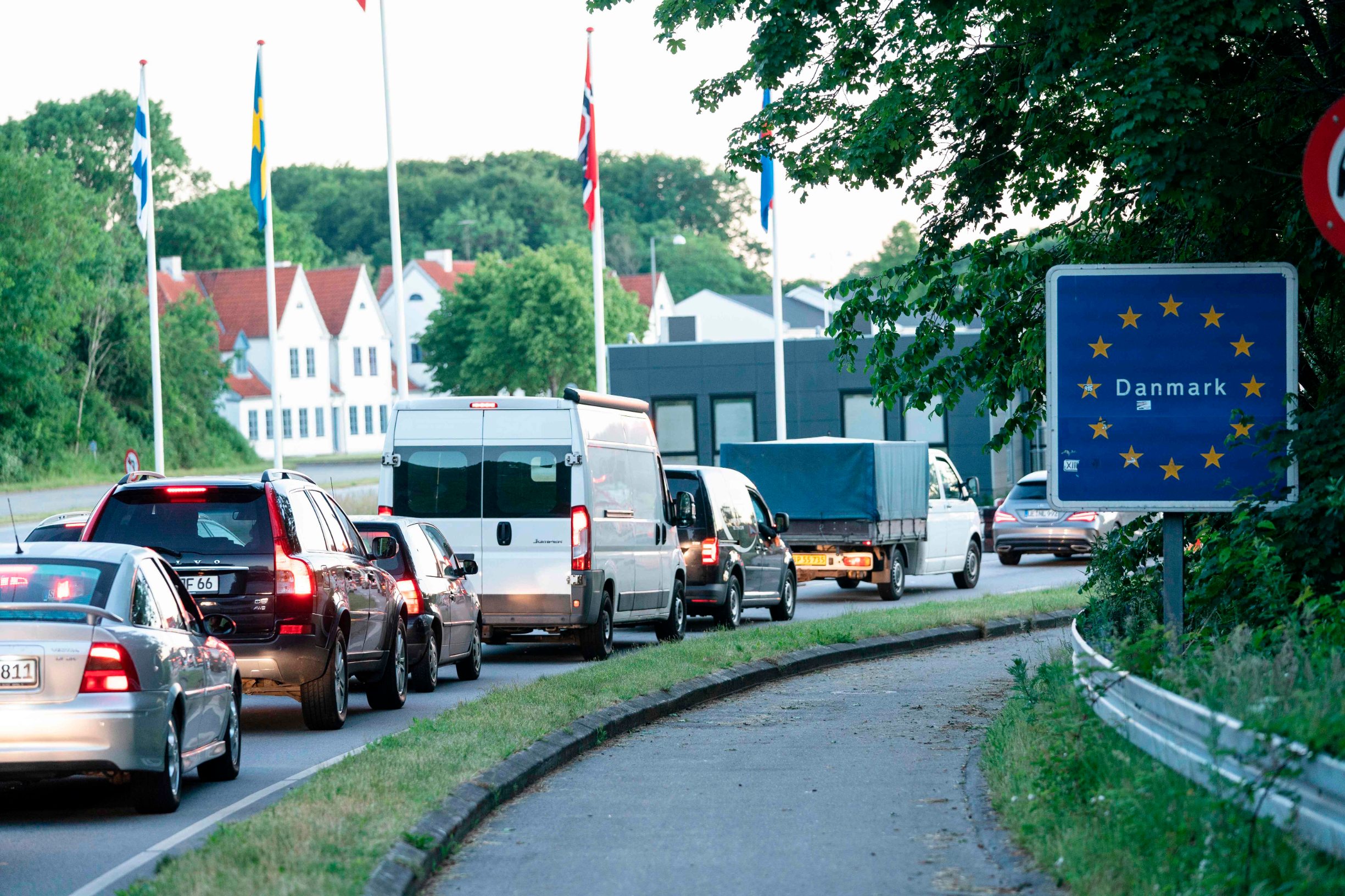 Northbound traffic from Germany into Denmark is queuing at the border between the two countries near the town of Krusa on June 15, 2020. - Holiday makers and day tourists joined commercial traffic as Denmark and other EU states re-opened their borders on Monday. (Photo by Claus Fisker / Ritzau Scanpix / AFP) / Denmark OUT