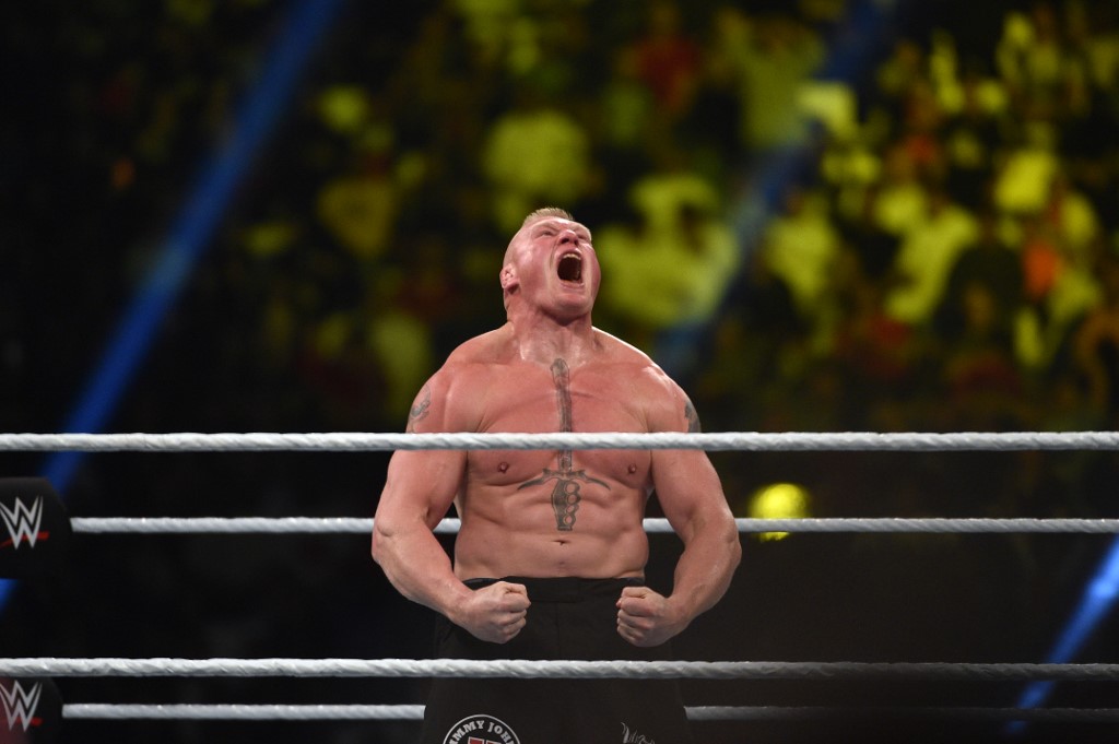 Brock Lesnar celebrates after winning the WWE Universal Championship match as part of as part of the World Wrestling Entertainment (WWE) Crown Jewel pay-per-view at the King Saud University Stadium in Riyadh on November 2, 2018. (Photo by Fayez Nureldine / AFP)