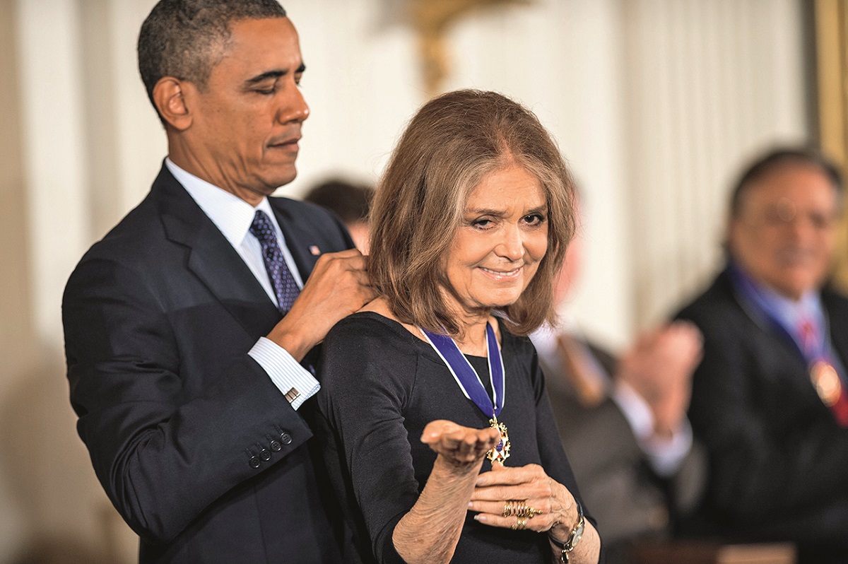 WASHINGTON, DC - NOVEMBER 20: Gloria Steinem (R) receives the 2013 Presidential Medal of Freedom from President Barack Obama at the White House on November 20, 2013 in Washington, DC. (Photo by Leigh Vogel/WireImage)