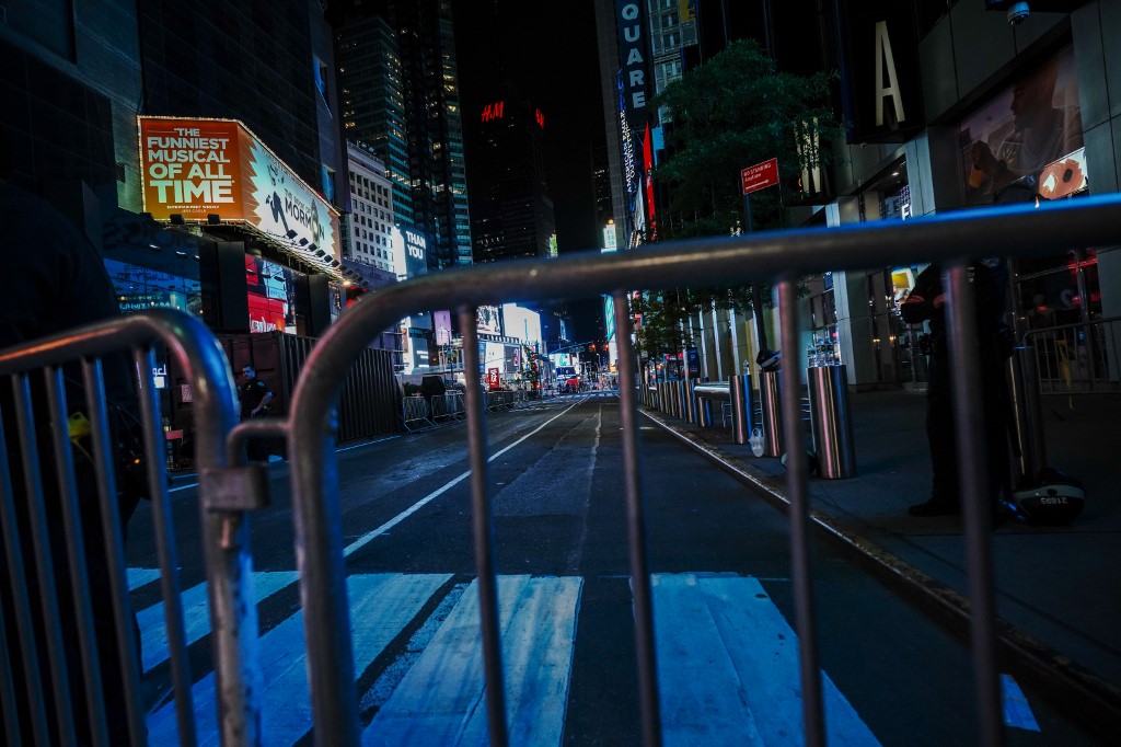 Following a night of often violent protests, demonstrators confront police in Manhattan as protests continue against the police killing of George Floyd on June 02, 2020 in New York City. Establishments such as Saks Fifth Ave.,  deploys security guards, flood lights barb wires and boarded windows to combat looters. Apple Flagship Store also installed wire fencing and boarded the whole glass facade. Times Square was closed off as well to discourage illegal assembly. Thousands of protesters took to the streets throughout the city yesterday to continue to show anger at Minneapolis Police officer Derek Chauvin who was filmed kneeling on George Floyd's neck before he was later pronounced dead at a local hospital. Floyd's death, the most recent in a series of deaths of black Americans at the hands of police, has set off days and nights of protests across the country. (Photo by John Nacion/NurPhoto)