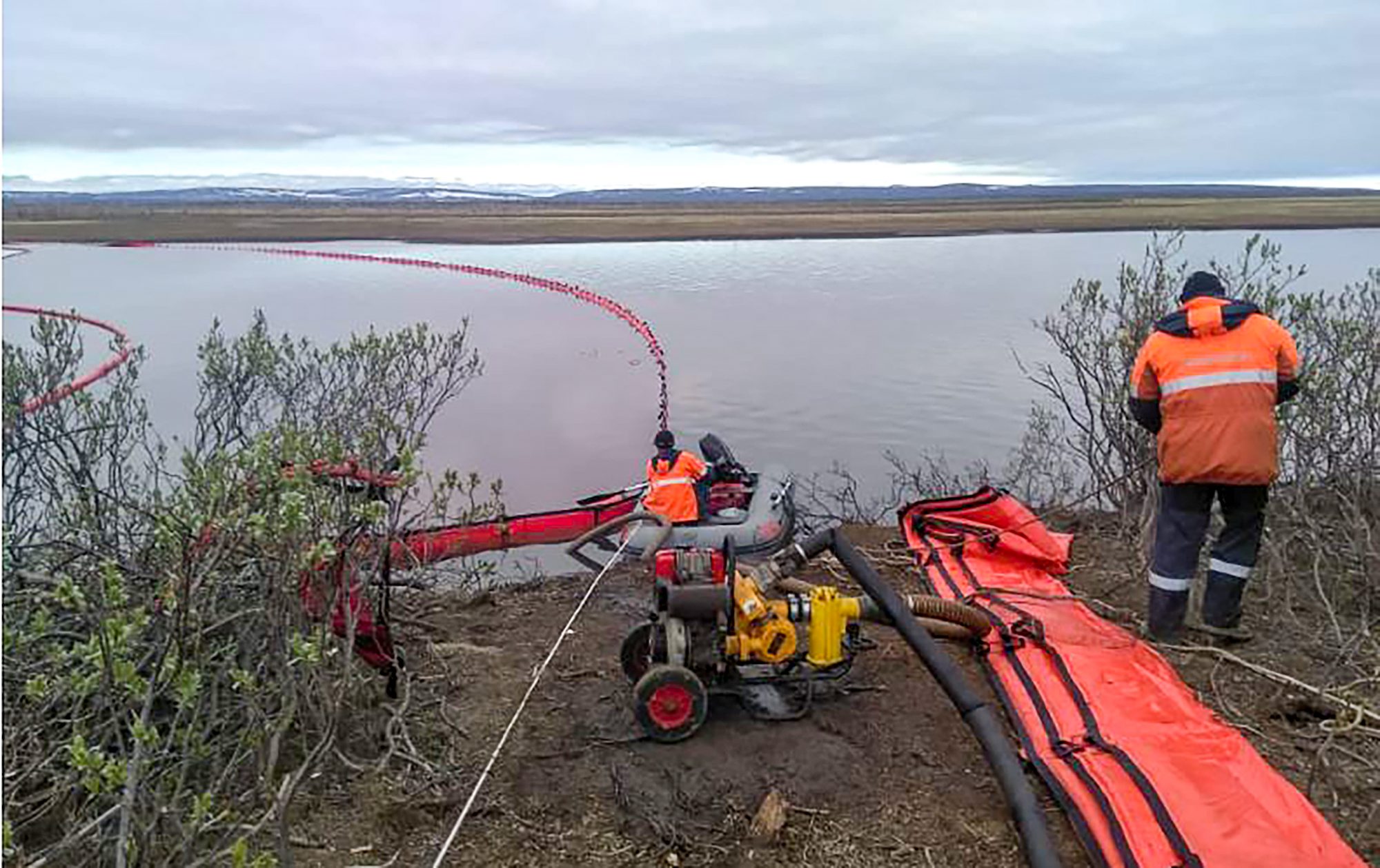 This handout photograph taken and released by the Marine Rescue Service of Russia on June 3, 2020, shows rescuers as they work near a large diesel spill in the Ambarnaya River outside Norilsk. - Russian President Vladimir Putin on June 3 ordered a state of emergency and criticised a subsidiary of metals giant Norilsk Nickel after a massive diesel spill into a Siberian river.
The spill of over 20,000 tonnes of diesel fuel took place on May 29, 2020. A fuel reservoir collapsed at a power plant near the city of Norilsk, located above the Arctic Circle, and leaked into a nearby river. (Photo by Yuri KADOBNOV / Marine Rescue Service / AFP) / RESTRICTED TO EDITORIAL USE - MANDATORY CREDIT 