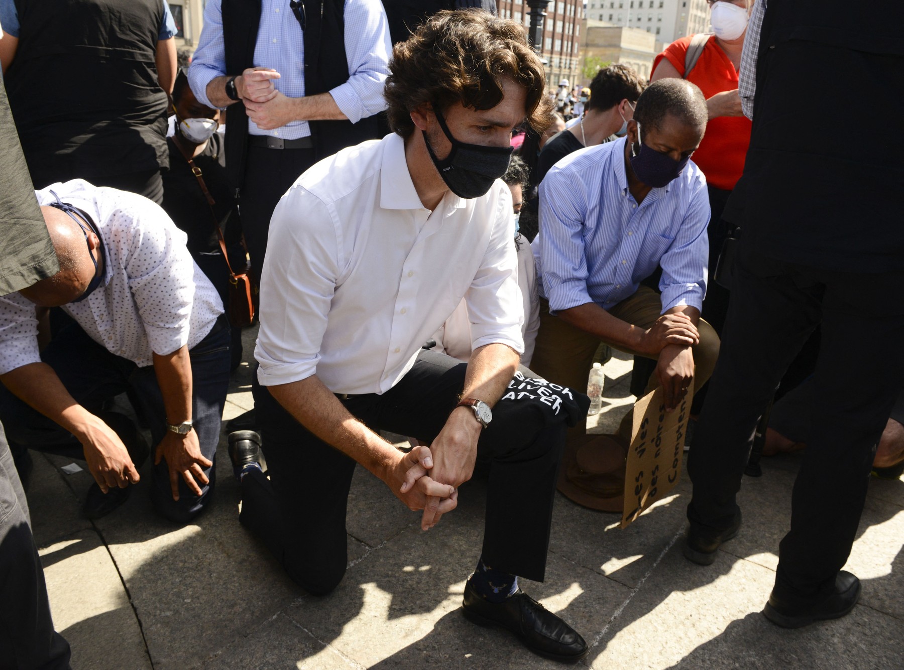 Prime Minister Justin Trudeau takes a knee during an 8 minute and 46 second silence as he takes part in an anti-racism protest on Parliament Hill during the COVID-19 pandemic in Ottawa on Friday, June 5, 2020. He is joined by Minister of Families, Children and Social Development Ahmed Hussen, left and Liberal MP Greg Fergus, right.,Image: 527633942, License: Rights-managed, Restrictions: , Model Release: no, Credit line: Kilpatrick Sean/CP/ABACA / Abaca Press / Profimedia