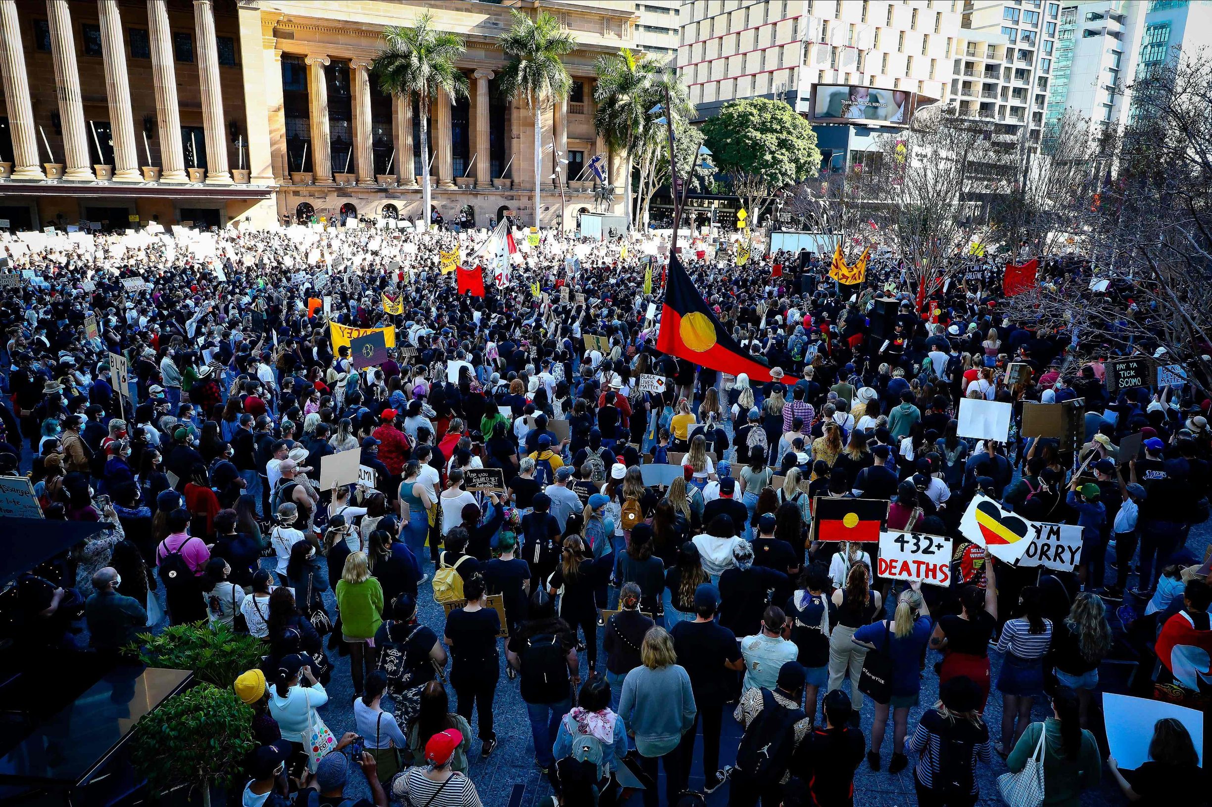 Demonstrators attend a Black Lives Matter protest to express solidarity with US protestors at King George Square in Brisbane on June 6, 2020 and demand an end to frequent Aboriginal deaths in custody in Australia. - Tens of thousands of Australians defied government calls to stay at home on June 6, spilling onto the streets for Black Lives Matter protests in major towns and cities across the country. (Photo by Patrick HAMILTON / AFP)
