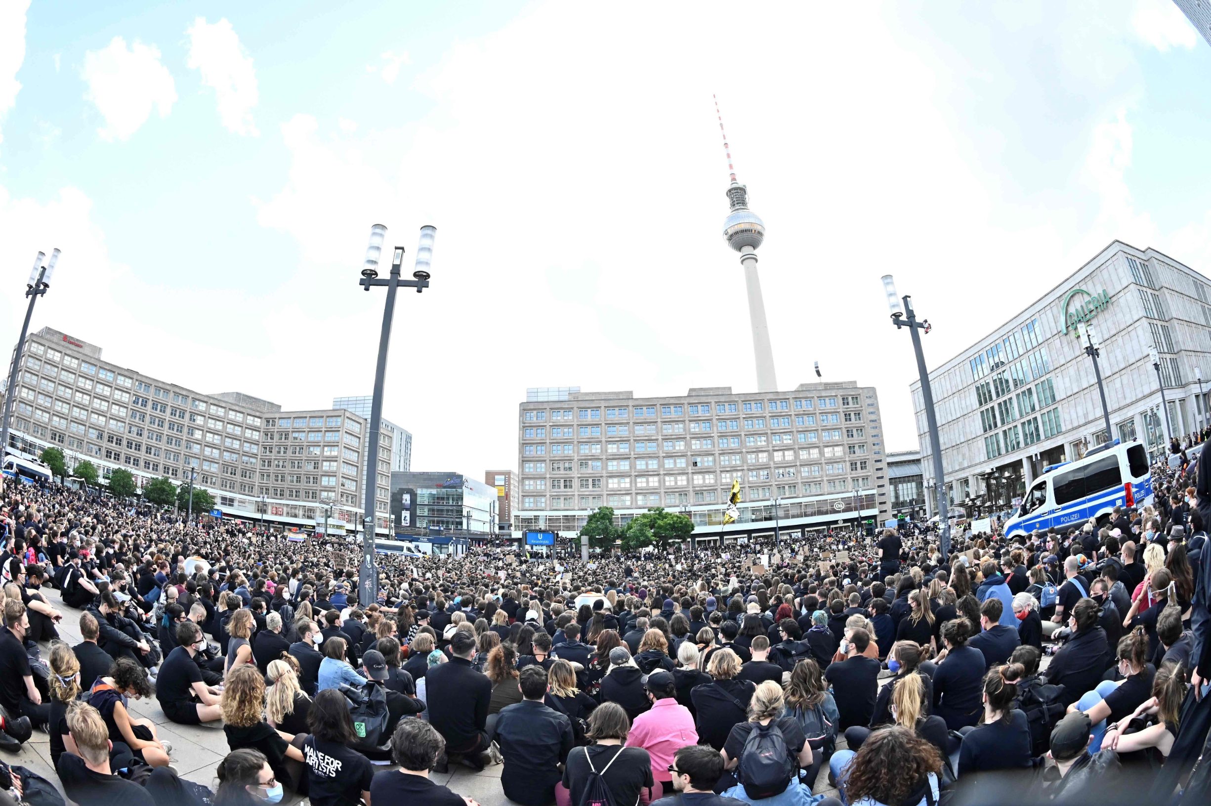 Protesters gather at Alexanderplatz square during a demonstration in solidarity with protests raging across the US over the death of George Floyd on June 6, 2020 in Berlin. - The death during the arrest of George Floyd, an unarmed black man in the US state of Minnesota, has brought tens of thousands out onto the streets during a pandemic that is ebbing in Asia and Europe, but spreading in other parts of the world. (Photo by Tobias SCHWARZ / AFP)