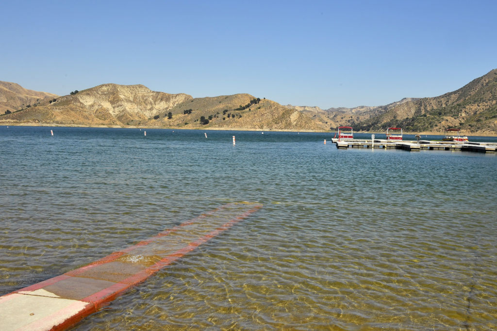 PIRU, CALIFORNIA - JULY 09:  Boats are docked and one is roped off with police tape (upper right) at Lake Piru, where actress Naya Rivera was reported missing Wednesday, on July 9, 2020 in Piru, California.  According to the Ventura County Sheriff’s Department this is believed to the boat that was rented by Rivera. Rivera, known for her role in 