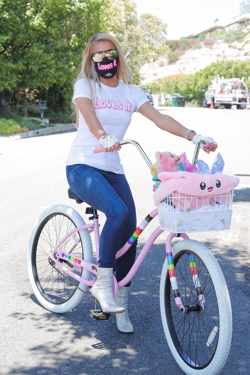 Exclusive - Beverly Hills, CA - 07/09/2020 - Paris Hilton bike riding around town. Each Paris Hilton Merch collection is tied to a social cause that Paris is passionate in helping & proceeds from each collection goes to different causes.

For the latest Paris Hilton Merch collection, 100% of the proceeds of the Boss Babe Tank go directly to the amazing LGBTQ Freedom Fund that focuses on posting bail to secure the safety of LGBTQ folks, who are 3 times more likely to be incarcerated than straight individuals.

Last month`s Paris Hilton Merch collection, - Proceeds from the sale of the Covid-19 design merch & face masks went to benefit Frontline Foods & Get US PPE for those deeply impacted by the Covid pandemic & at the frontlines.
 
-PICTURED: Paris Hilton with dog Princess Paris Jr
-,Image: 541971533, License: Rights-managed, Restrictions: Exclusive, Model Release: no, Credit line: JESSE BAUER / INSTAR Images / Profimedia