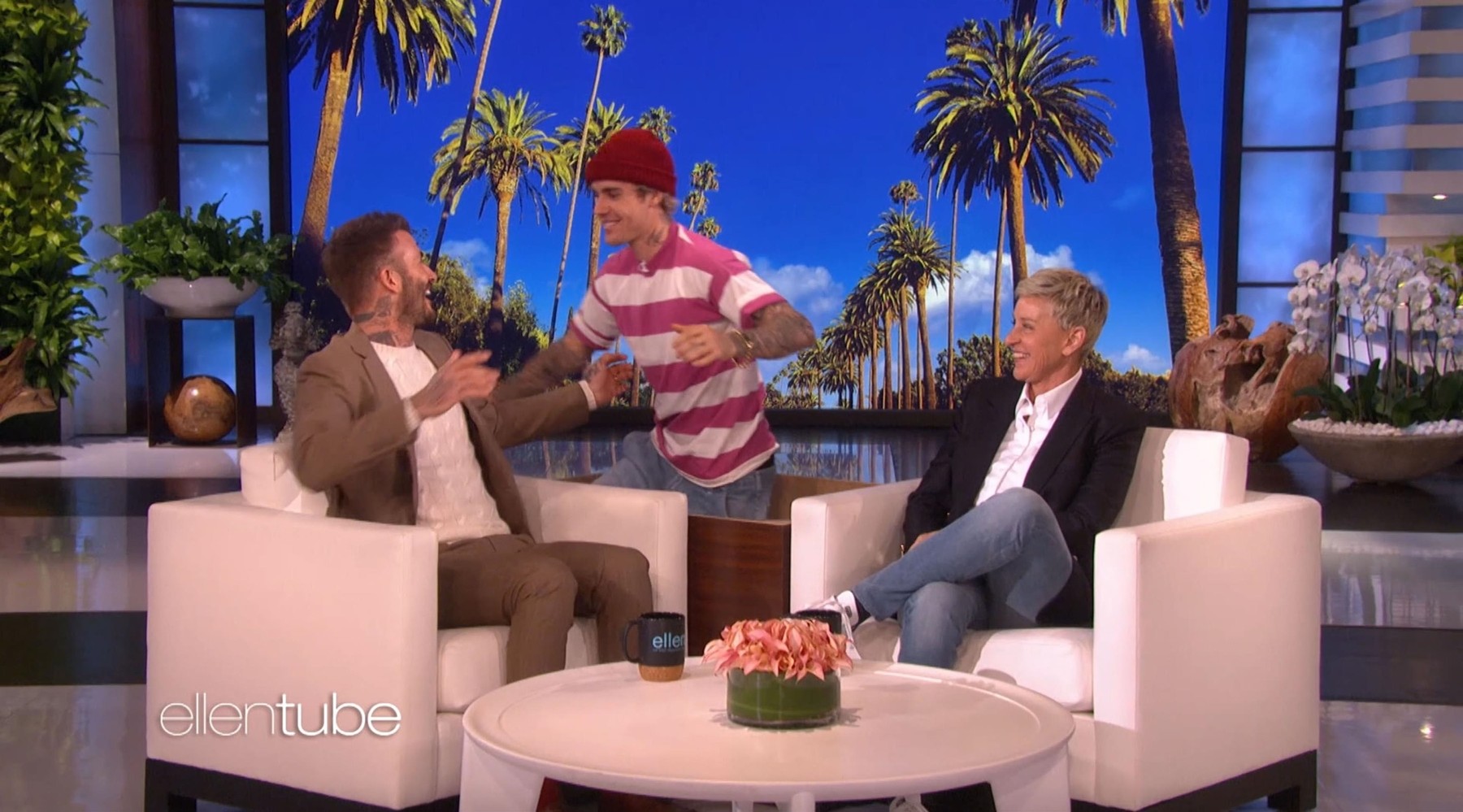 Los Angeles, CA  - Justin Bieber tries to scare David Beckham on The Ellen Show. The former soccer star was on the show to chat about his new Miami soccer team but also spoke about his  eight year-old daughter Harper, and how his 15 year-old son Cruz is starting to play the mandolin that David bought him for . He also spoke about guest-starring on Modern Family and revealed he’s not into exploring acting as a career. But it was while he was chatting about trick-or-treating at Justin Bieber‘s house last Halloween that the Yummy singer himself hilariously jumped out of a coffee table next to Beckham, trying to scare him. As Bieber screamed in his face, Beckham seemed almost unfazed by the prank before bursting into laughter. He then jumped up and hugged Bieber, before the singer ran off backstage. Chatting about Bieber before the scare, Beckham revealed: 