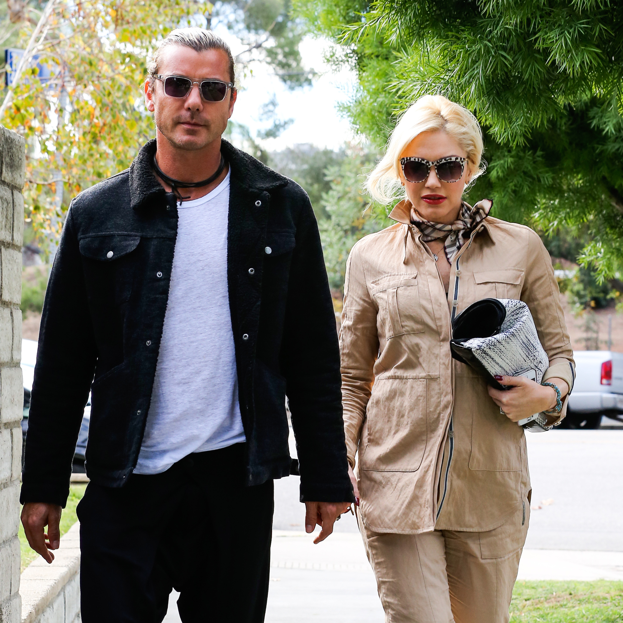 Sherman Oaks, CA - Part 2 - Gwen Stefani and her husband Gavin Rossdale are all smiles after finishing up an appointment in Sherman Oaks. Gwen covered her growing belly in a full khaki outfit, accessorized with a Burberry scarf, black and cream clutch, leopard print sunglasses, and black L.A.M.B. booties.
        November  22, 2013,Image: 177541742, License: Rights-managed, Restrictions: NO Brazil,NO Brazil, Model Release: no, Credit line: AKM Images / Backgrid USA / Profimedia