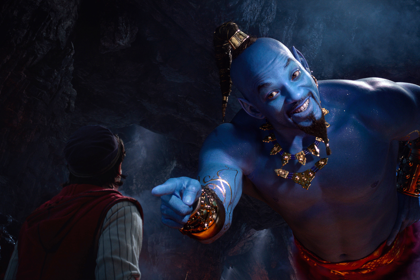 Aladdin (Mena Massoud) meets the larger-than-life blue Genie (Will Smith) in Disney’s live-action adaptation ALADDIN, directed by Guy Ritchie.