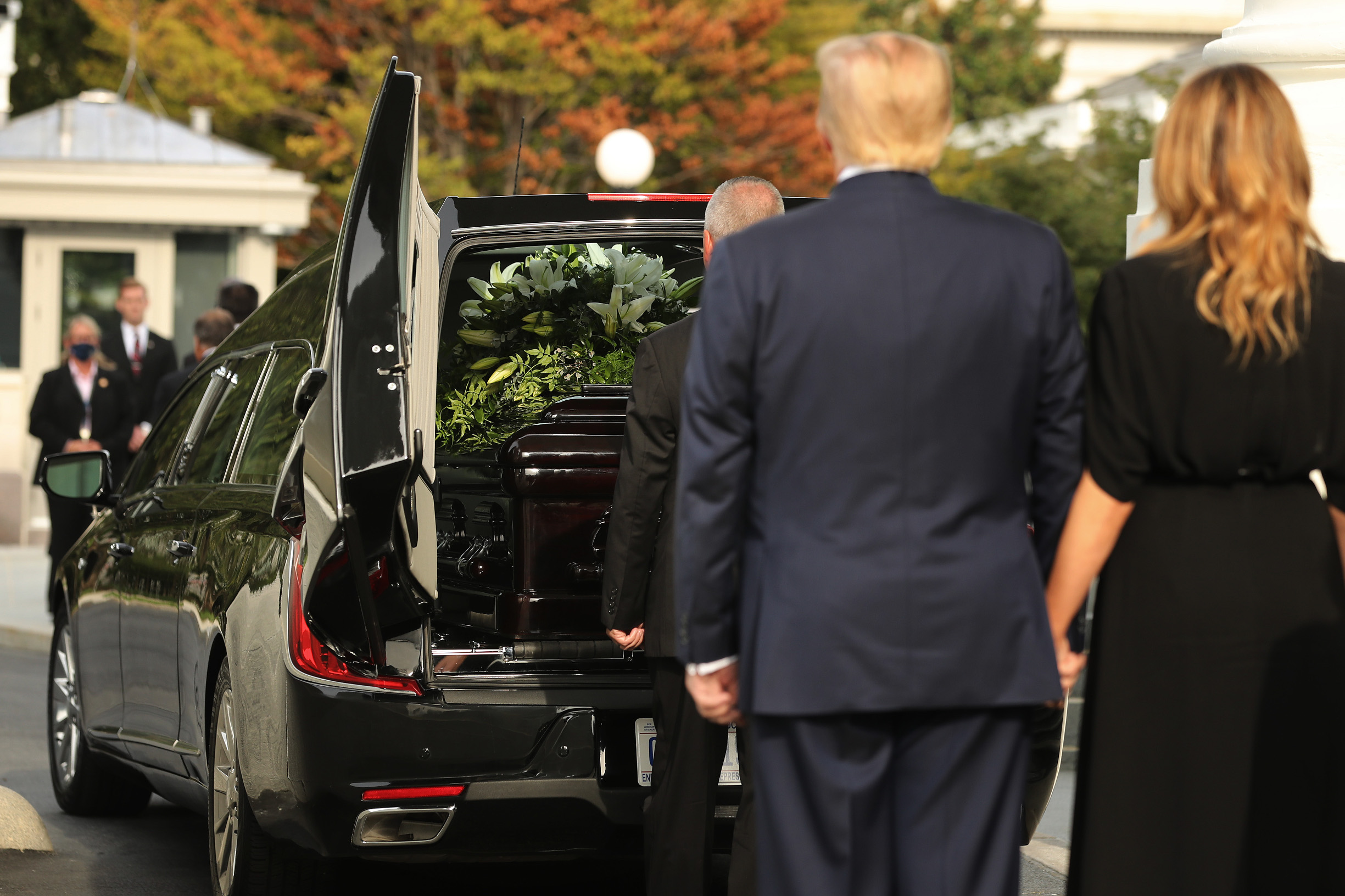 WASHINGTON, DC - AUGUST 21: U.S. President Donald Trump and first lady Melania Trump look on as Robert Trump’s casket is loaded into a hearse at the North Portico of the White House following his funeral service on August 21, 2020 in Washington, DC. Robert Trump passed away on August 15 at the age of 71. In a statement, President Trump wrote, “He was not just my brother, he was my best friend.