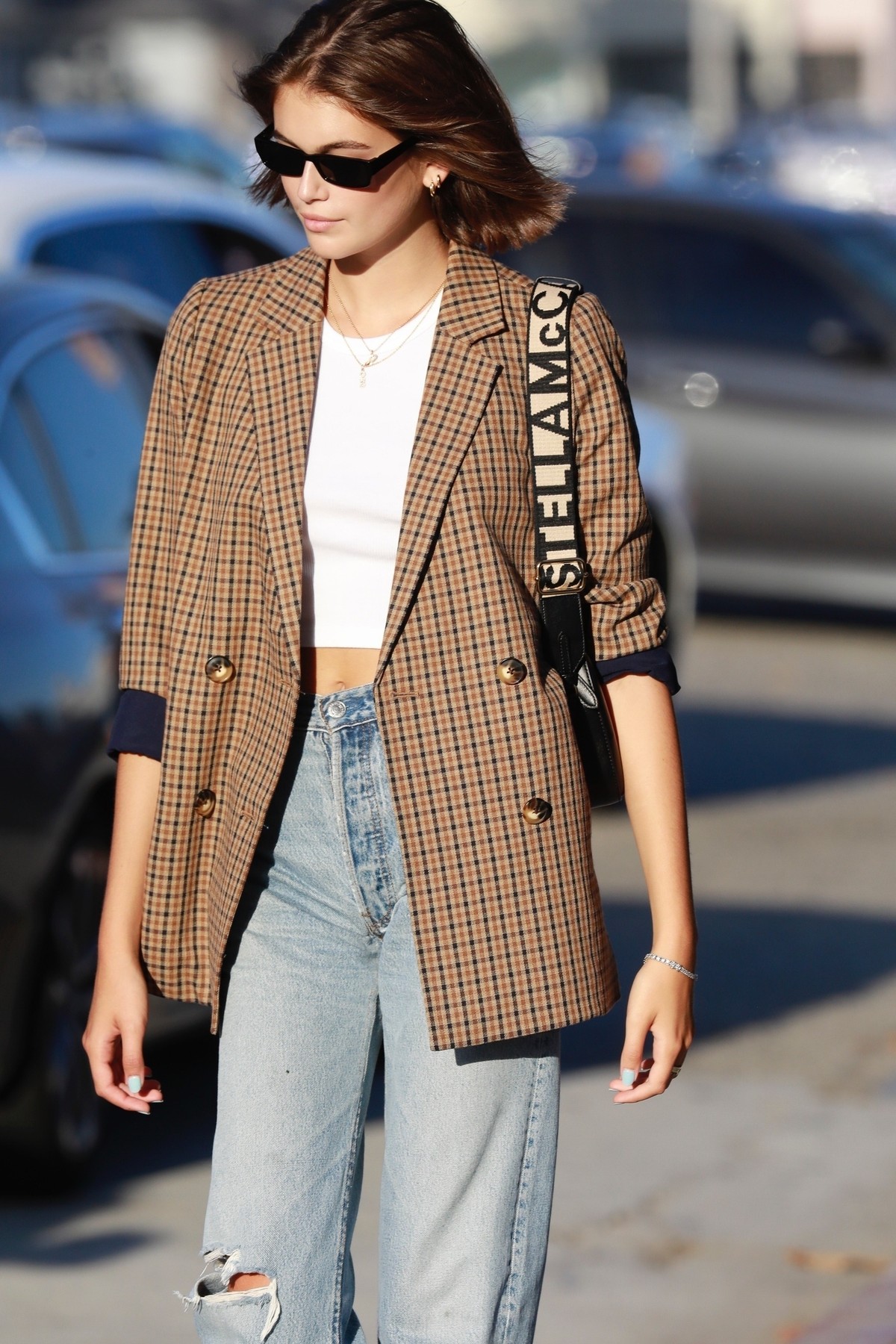 Malibu, CA  - *EXCLUSIVE*  - Kaia Gerber spotted leaving Nobu after a late lunch. The model looks casual but stylish in jeans, a white top and a plaid blazer paired with black high top converse sneakers.

*UK Clients - Pictures Containing Children
Please Pixelate Face Prior To Publication*,Image: 467256166, License: Rights-managed, Restrictions: , Model Release: no, Credit line: BACKGRID / Backgrid USA / Profimedia
