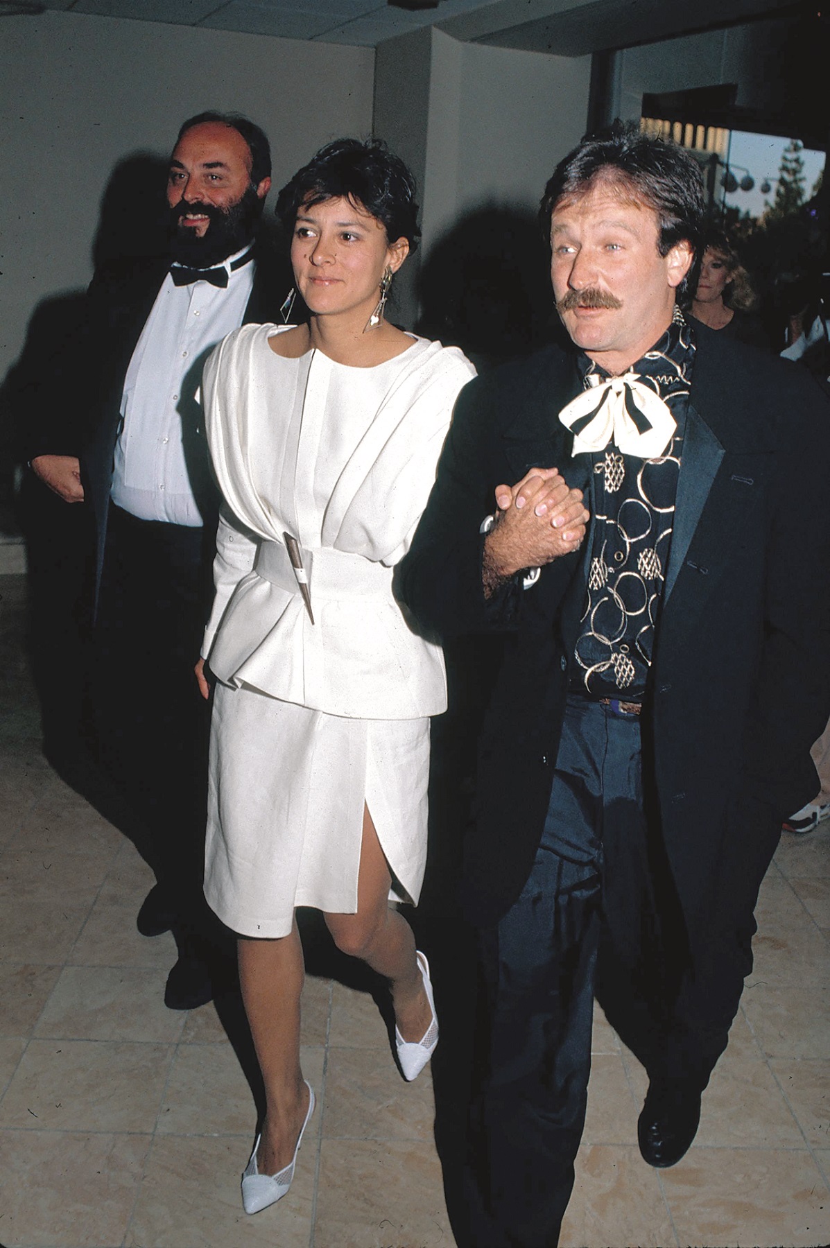 1989, Los Angeles, California, USA: Actor Robin Williams' wife Marsha Garces Williams, files for divorce from the Oscar-winning actor after a 19-year marriage, citing irreconcilable differences. The couple was married in 1989, shortly after the actor's divorce from his previous wife and have two children, an 18-year-old daughter and a 16-year-old son.///Actor Robin Williams (R) with wife Marsha Garces Williams (C) attending the Comedy Awards at the Hyatt Regency Hotel in Century City.,Image: 24795090, License: Rights-managed, Restrictions: , Model Release: no, Credit line: Gary Lewis / Polaris / Profimedia
