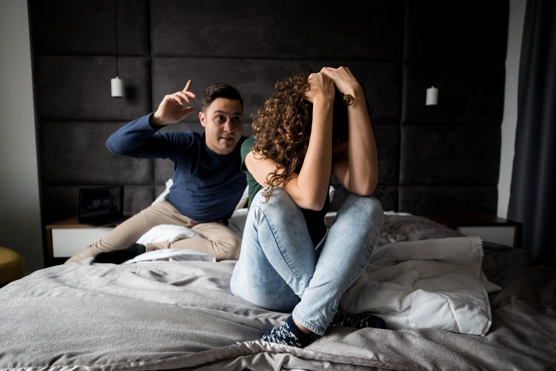 Couple fighting in the bedroom and having some relationship problems