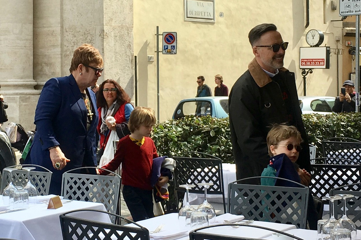 EXCLUSIVE: EXC.

Elton John's husband David Furnish is spotted taking their kids Elijah Joseph Daniel Furnish-John, Zachary Jackson Levon Furnish-John for a stroll in Spanish Steps during a roman holiday, when they dangerously lean out the top terrace of Spanish Steps they are scolded by a traffic warden policewoman and one of the kid starts crying so the policewoman approach them to apologize and let the crying child try her hat on, after a while they stop to pose and joke with the ancient roman impersonators and one of them put a crown on one of the kids head. The end up the walk by joining Elton John for lunch at the Bolognese restaurant.
24 Mar 2018,Image: 366832500, License: Rights-managed, Restrictions: World Rights, Model Release: no, Credit line: MEGA / The Mega Agency / Profimedia
