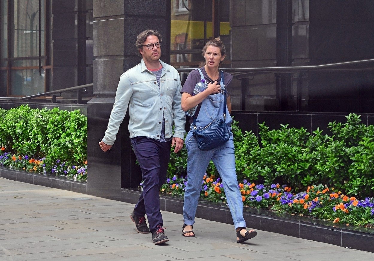 BGUK_1250180 - *EXCLUSIVE* London, UNITED KINGDOM  - *EXCLUSIVE - WEB MUST CALL FOR PRICING*  - British chef Jamie Oliver dons some Harry Potter looking spectacles while out enjoying a stroll with wife Jools Oliver in Mayfair.

Pictured: Jamie Oliver, Jools Oliver

*UK Clients - Pictures Containing Children
Please Pixelate Face Prior To Publication*,Image: 373617554, License: Rights-managed, Restrictions: , Model Release: no, Credit line: DASA / Backgrid UK / Profimedia