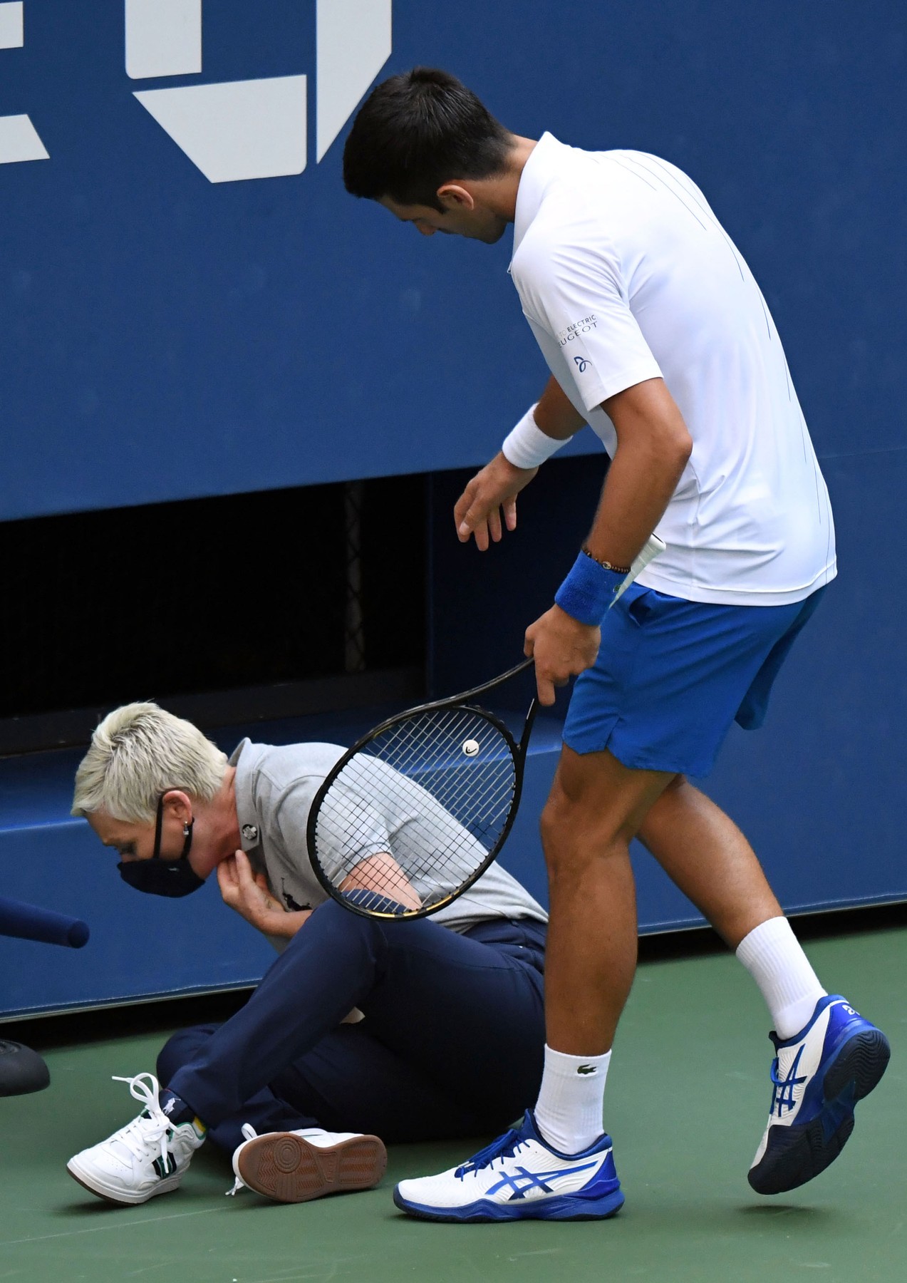 Sep 6, 2020; Flushing Meadows, New York, USA; Novak Djokovic of Serbia checks on a line judge after he unintentionally hit her with a tennis ball after losing a game to Pablo Carreno Busta of Spain (not pictured) on day seven of the 2020 U.S. Open tennis tournament at USTA Billie Jean King National Tennis Center.,Image: 556572205, License: Rights-managed, Restrictions: *** World Rights ***, Model Release: no, Credit line: USA TODAY Network / ddp USA / Profimedia