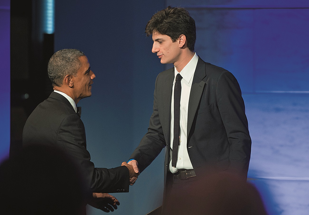WASHINGTON, DC - NOVEMBER 20: President Barack Obama shakes hands with Jack Schlossberg, the Grandson of President John F. Kennedy, after he introduced Obama, during a dinner in honor of the Medal of Freedom awardees at the Smithsonian National Museum of American History on November 20, 2013 in Washington, DC. The Presidential Medal of Freedom is the nation's highest civilian honor, presented to individuals who have made meritorious contributions to the security or national interests of the United States, to world peace, or to cultural or other significant public or private endeavors. (Photo by Kevin Dietsch-Pool/Getty Images)