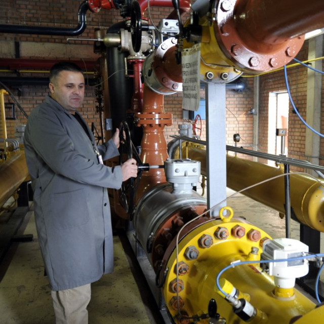 Technician in the state owned company Sarajevo Gas walks through gas distribution chamber near Sarajevo