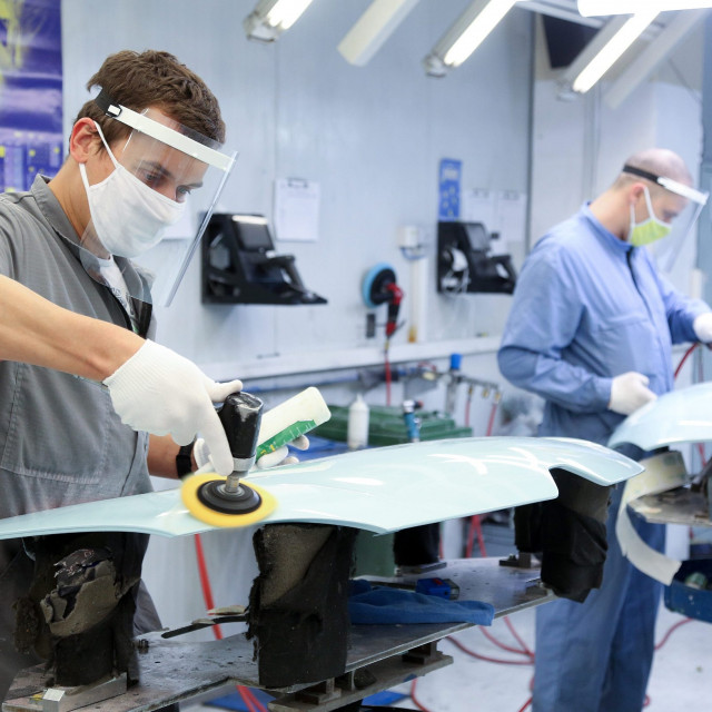 On the photo: Workers with protective gear in the factory AD Plastik, Zagreb
