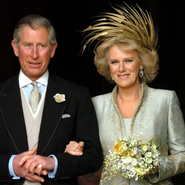 Prince Charles and Camilla, Duchess of Cornwall after their blessing at St George&#39;s Chapel<br />
THE ROYAL WEDDING OF PRINCE CHARLES AND CAMILLA PARKER BOWLES, WINDSOR, BRITAIN - 09 APR 2005<br />
<br />
MARRIAGE GOLD METALLIC FEATHER FEATHERS SWAROWSKI DIAMOND DIAMONDS HEADDRESS HAT BRITISH,Image: 221369524, License: Rights-managed, Restrictions:, Model Release: no, Credit line: -/Shutterstock Editorial/Profimedia