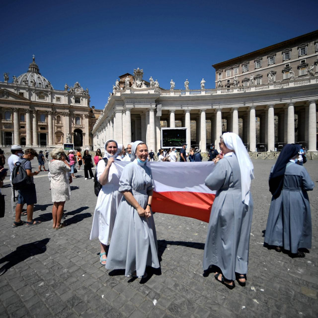 A group of polish nuns wait for Pope Francis to deliver his blessing from the window overlooking St. Peter&amp;#39;s Square, at the Vatican, during the Sunday Angelus prayer on July 19, 2020. (Photo by Filippo MONTEFORTE/AFP)