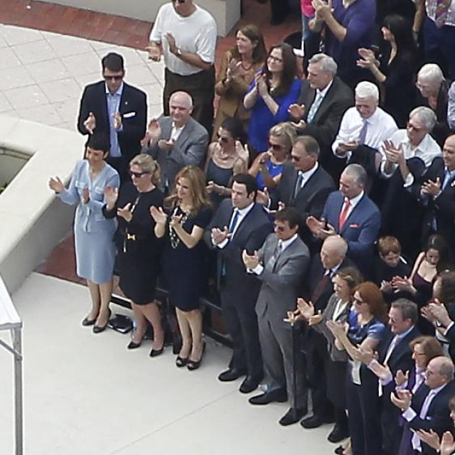 Nov. 17, 2013 - Clearwater, Florida, U.S. - Actors JOHN TRAVOLTA and TOM CRUISE, first row, fifth and sixth from left, applaud Scientology leader David Miscavige during the dedication of their massive Flag Building. The seven-story, $145 million neo-Mediterranean building is also known as the ''Super Power'' building because it reportedly will be the only place where a highly classified Super Power program, first advanced by church founder L. Ron Hubbard in the 1970s, will be conducted.,Image: 176917098, License: Rights-managed, Restrictions: * Tampa Tribune OUT *, Model Release: no, Credit line: James Borchuck/Zuma Press/Profimedia