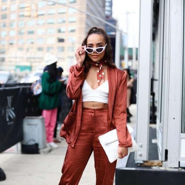 NEW YORK, NEW YORK - FEBRUARY 09: Blogger Mata Leiataua is seen wearing a dark orange suit, white top and white sunglasses outside of Spring Studios during New York Fashion Week on February 09, 2020 in New York City. (Photo by Donell Woodson/Getty Images)