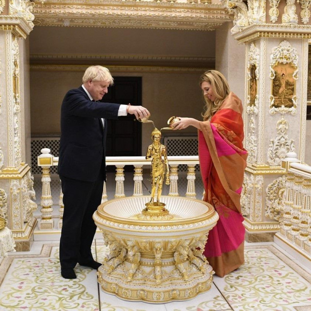 December 7, 2019, Heald Green, Cheshire, United Kingdom: Image ©Licensed to i-Images Picture Agency. 07/12/2019. Heald Green,, United Kingdom. Boris Johnson General Election Campaign Day 28. Britain's Prime Minister Boris Johnson and his partner Carrie Symonds visit Neasden Temple on day 28 of the General election campaign.,Image: 486961496, License: Rights-managed, Restrictions: * China, France, Italy, Spain, Taiwan and UK Rights OUT *, Model Release: no, Credit line: Andrew Parsons/Zuma Press/Profimedia