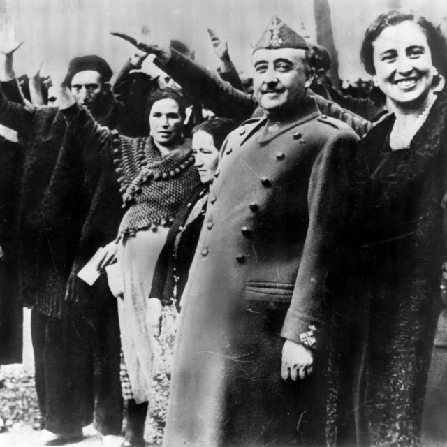 Spanish military dictator General Francisco Franco (second from right) and his wife Dona Carmen Polo are saluted at a reception at Burgos to award the parents of large families with sums of money. (Photo by Keystone/Getty Images)