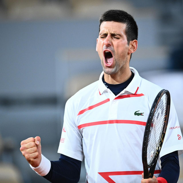 Serbia&amp;#39;s Novak Djokovic celebrates after winning against Spain&amp;#39;s Pablo Carreno Busta during their men&amp;#39;s singles quarter-final tennis match on Day 11 of The Roland Garros 2020 French Open tennis tournament in Paris on October 7, 2020. (Photo by Anne-Christine POUJOULAT/AFP)