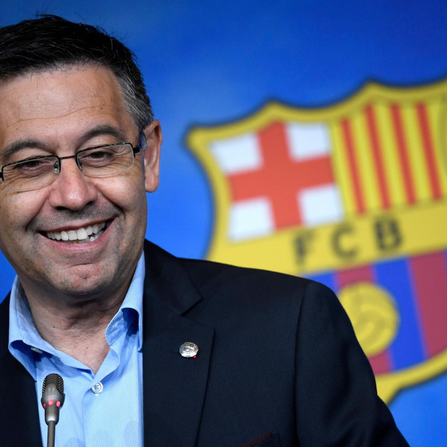 (FILES) In this file photo taken on July 05, 2019 Barcelona's president Josep Maria Bartomeu smiles during a press conference at the Camp Nou stadium in Barcelona. - An unexpected winner in 2015 and Barcelona's bad guy in 2020, the club's president Josep Maria Bartomeu might feel some satisfaction after winning his showdown with Lionel Messi. (Photo by LLUIS GENE/AFP)