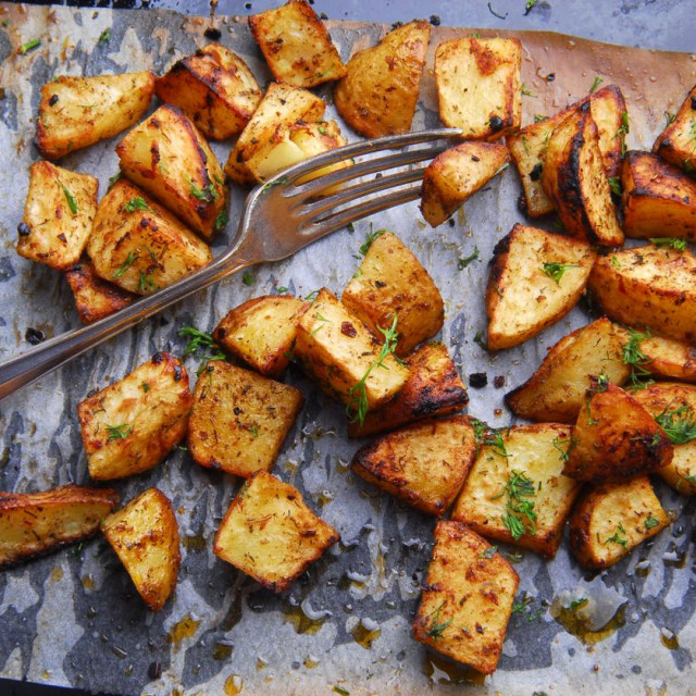 roasted potatoes and fork