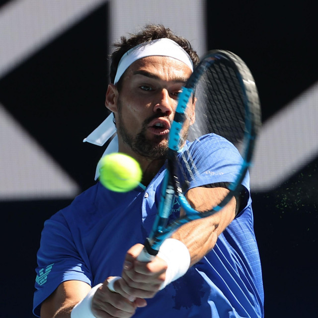 Italy&amp;#39;s Fabio Fognini hits a return against France&amp;#39;s Benoit Paire during their group C men&amp;#39;s singles tennis match on day two of the 2021 ATP Cup in Melbourne on February 3, 2021. (Photo by DAVID GRAY/AFP)/-- IMAGE RESTRICTED TO EDITORIAL USE - STRICTLY NO COMMERCIAL USE --