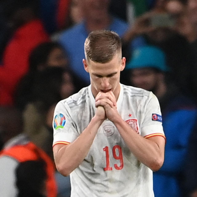 Spain's midfielder Daniel Olmo reacts after missing a penalty during the UEFA EURO 2020 semi-final football match between Italy and Spain at Wembley Stadium in London on July 6, 2021. (Photo by Andy Rain/POOL/AFP)