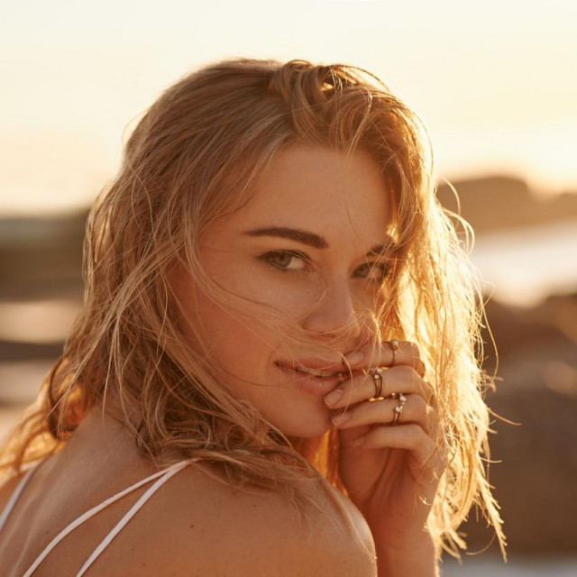 Portrait of a beautiful young woman on the beach