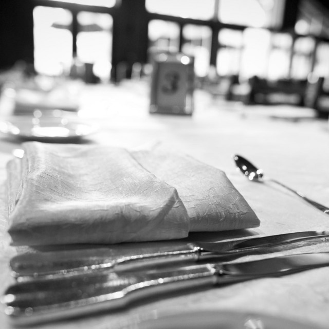 ”Wedding Dinner Table Setup of Dishes, Glasses and Silverware”