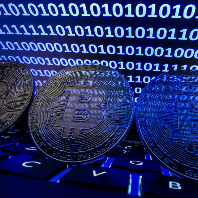 Representation of Bitcoin is seen with binary code displayed on a laptop screen in this illustration photo taken in Krakow, Poland on August 17, 2021. (Photo by Jakub Porzycki/NurPhoto) (Photo by Jakub Porzycki/NurPhoto/NurPhoto via AFP)