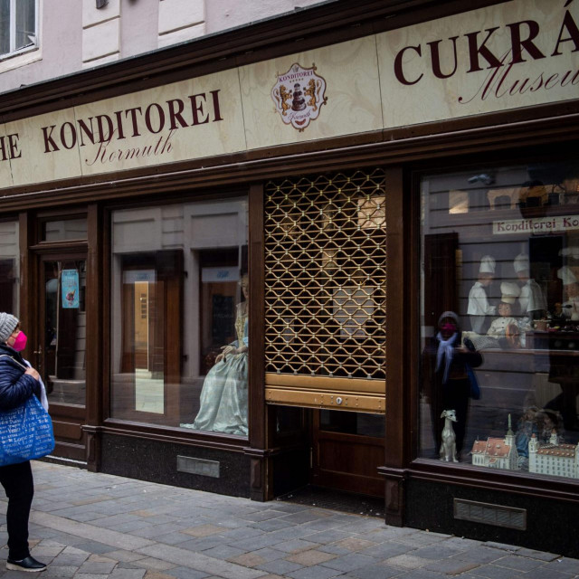 &lt;p&gt;A woman stands in front of the closed patisserie in Bratislava downtown on November 25, 2021. - Slovakia declared a two-week lockdown following a spike in COVID-19 cases with the country�s seven-day average of cases rise above 10,000. (Photo by VLADIMIR SIMICEK/AFP)&lt;/p&gt;
