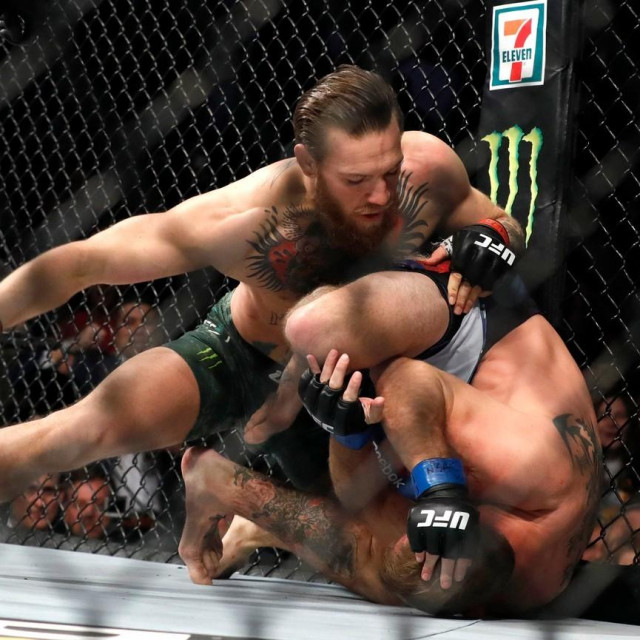 LAS VEGAS, NEVADA - JANUARY 18: Conor McGregor (L) punches Donald Cerrone in a welterweight bout during UFC246 at T-Mobile Arena on January 18, 2020 in Las Vegas, Nevada. McGregor won by first-round TKO. Steve Marcus,Image: 493546180, License: Rights-managed, Restrictions:, Model Release: no, Credit line: Steve Marcus/Getty images/Profimedia
